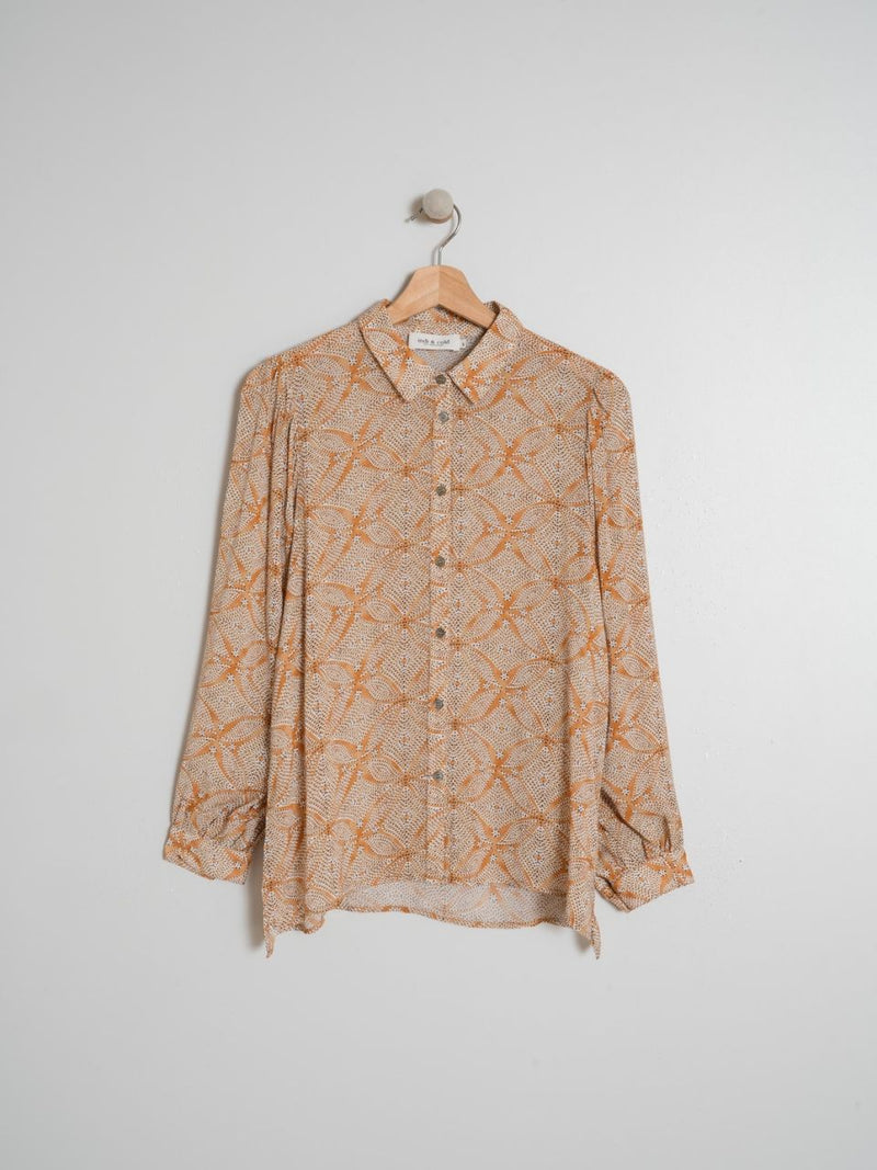 Camisa dibujos naranjas puntitos