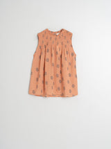 camisa abrochada atras nido sin mangas