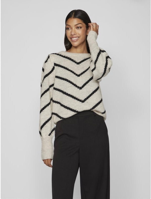 Jersey beige raya en V negra